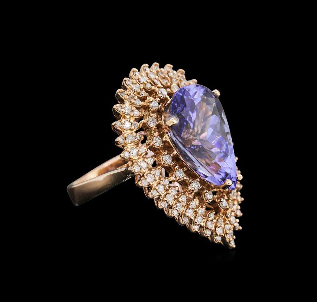 8.88 ctw Tanzanite and Diamond Ring - 14KT Rose Gold: One electronically tested 14KT rose gold lady's cast fashion ring with a basket halo with a bright polish finish. The featured lady's ring has a shank measuring 3.35mm in width Identified with marking
