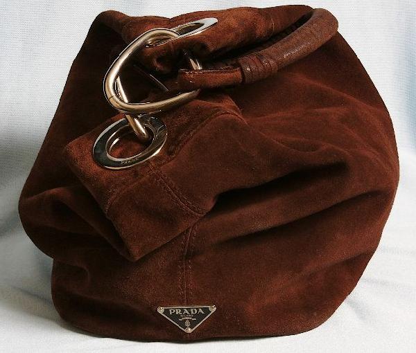 Authentic Prada Brown Suede Bucket Bag. ED401: Authentic Prada Brown Suede Bucket Bag. ED401. Excellent Vintage Condition! GF67YU. Vintage Prada Bucket Shoulder Bag. Clean - retails over $1,200 new! Dimensions: 16 x (base 10" x 7") x H12" Shoulder