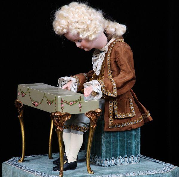 Antique Style Animated Music Box. NS55: "Antique Style Animated Music Box. NS55. Excellent Vintage Condition! SLKA This Victorian style music box is animated and from Switzerland. It features young Mozart on the piano. Stands approx. 13" hi