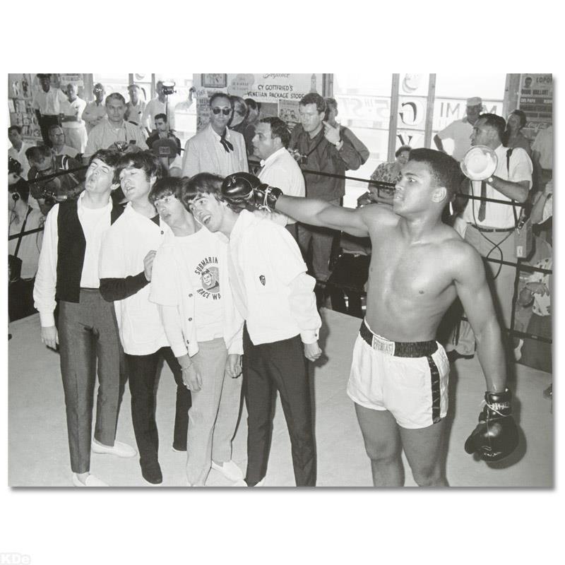 Muhammad Ali Punching The Beatles by Ali, Muhammad: Own a piece of sports history with this Muhammad Ali and Beatles photo. Taken at the peak of his success as one of the greatest heavyweight championship boxers of all time, this photo is sure to compl
