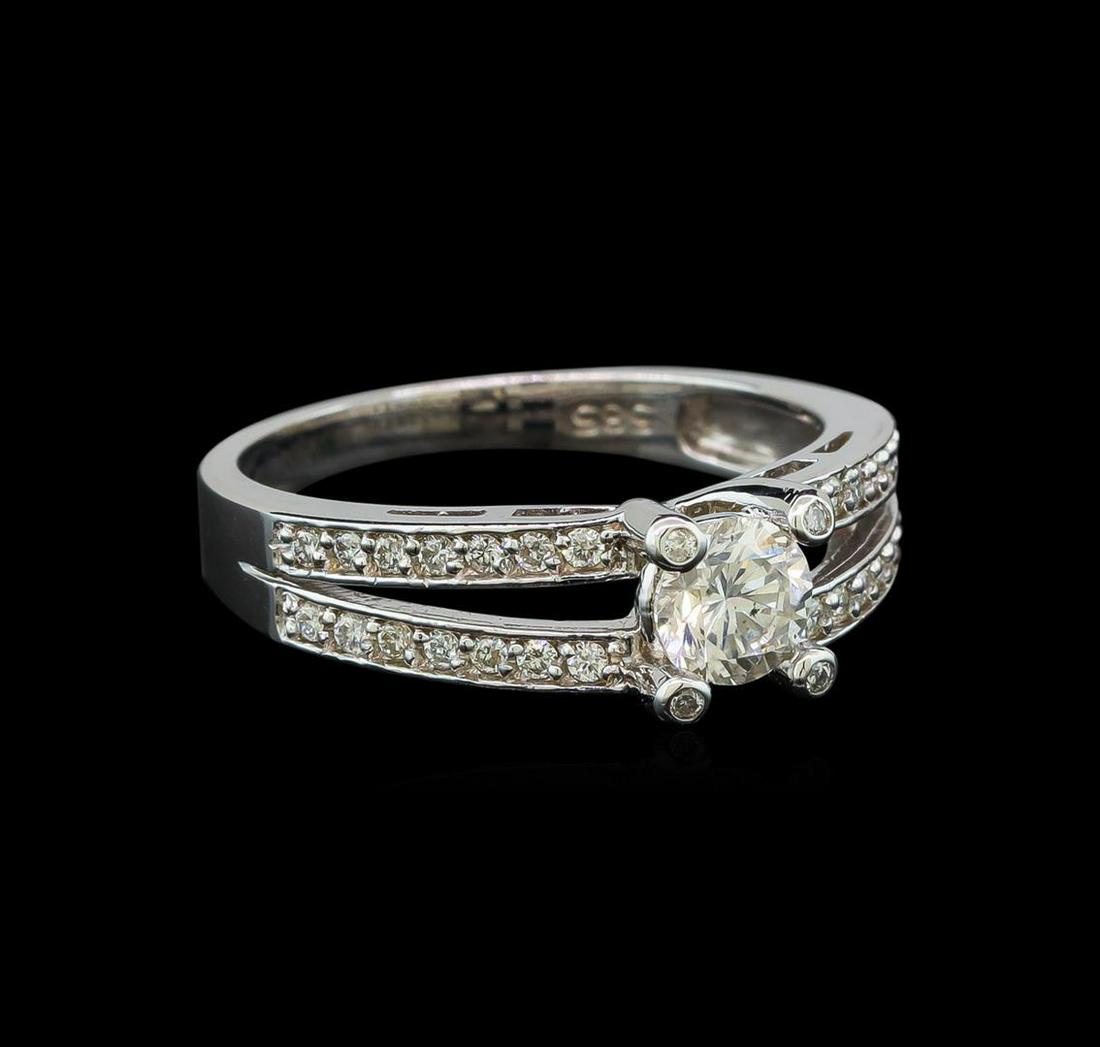 0.77 ctw Diamond Ring - 14KT White Gold: One electronically tested 14KT white gold lady's cast wedding ring with a split shank with a bright polish finish. The featured lady's ring has a shank measuring 2.24 millimeters wide. Identified with