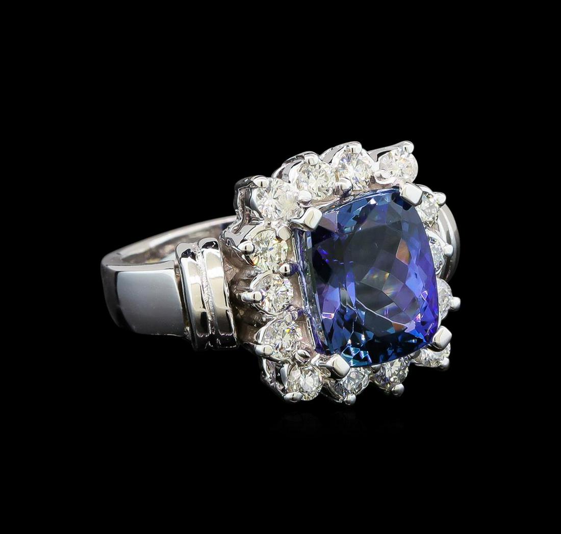 14KT White Gold 3.54 ctw Tanzanite and Diamond Ring: One electronically tested 14KT white gold ladies cast tanzanite and diamond ring with a bright polish finish. Condition is new. Containing: One prong set rectangular cushion modified brilliant cut nat