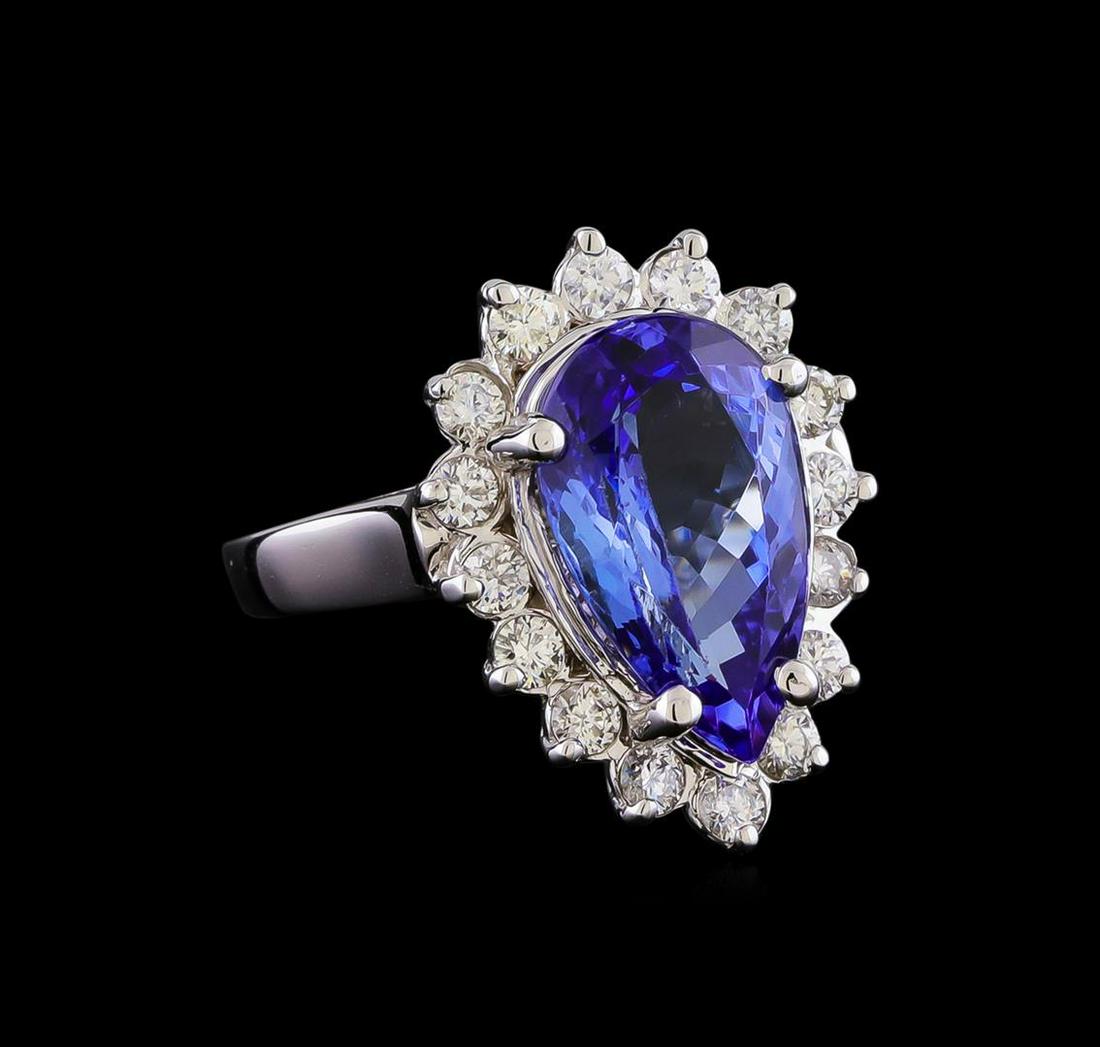 5.02 ctw Tanzanite and Diamond Ring - 14KT White Gold: One electronically tested 14KT white gold lady's cast fashion ring with a cathedral basket halo with a bright polish finish. The featured lady's has a shank measuring 2.35 millimeters in width. Identi
