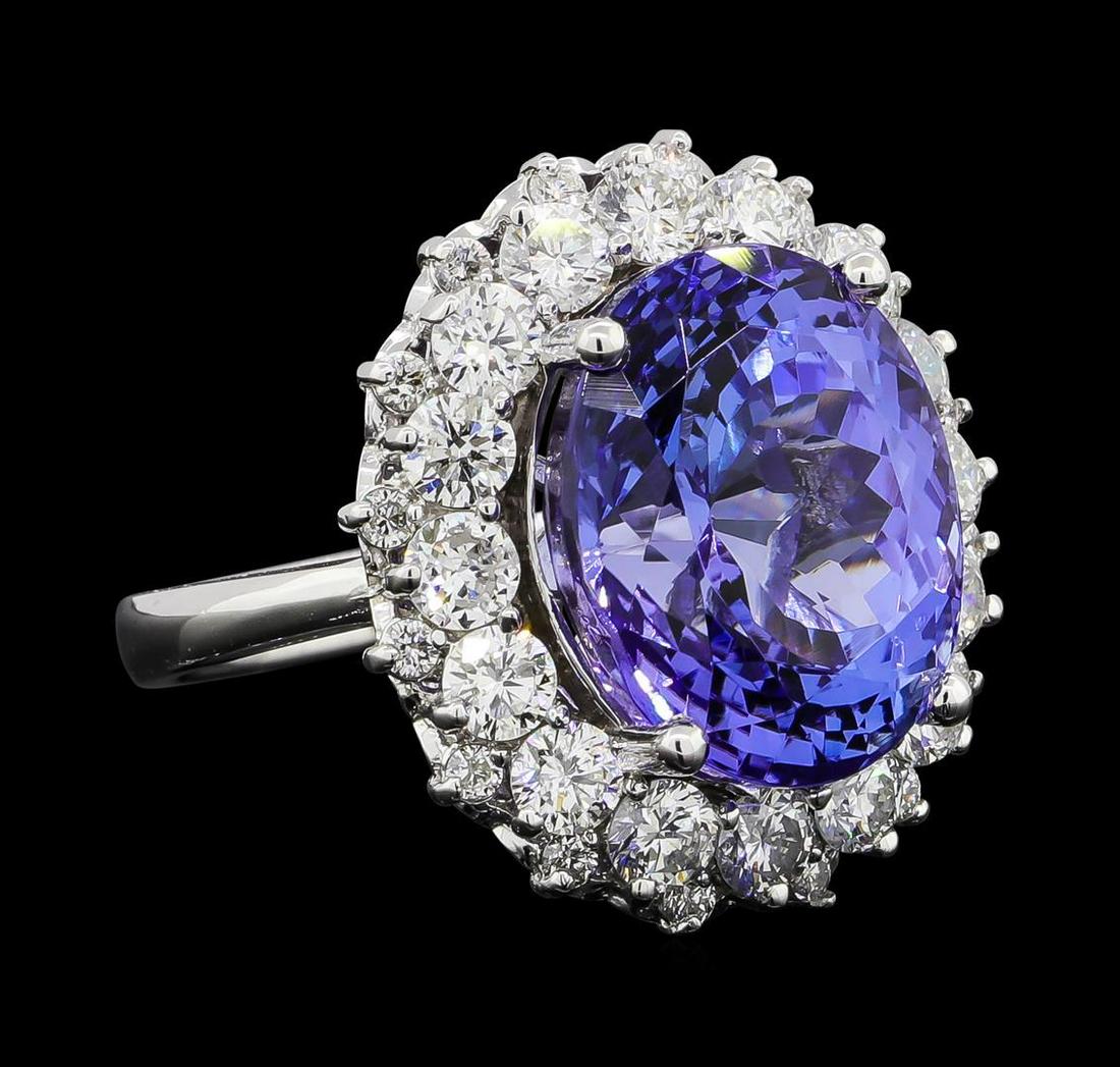 GIA Cert 12.06 ctw Tanzanite and Diamond Ring - 14KT: One electronically tested 14KT white gold lady's cast fashion ring with a basket double halo with a bright polish finish. The featured lady's ring has a shank measuring 2.69 millimeters wide. Identifi