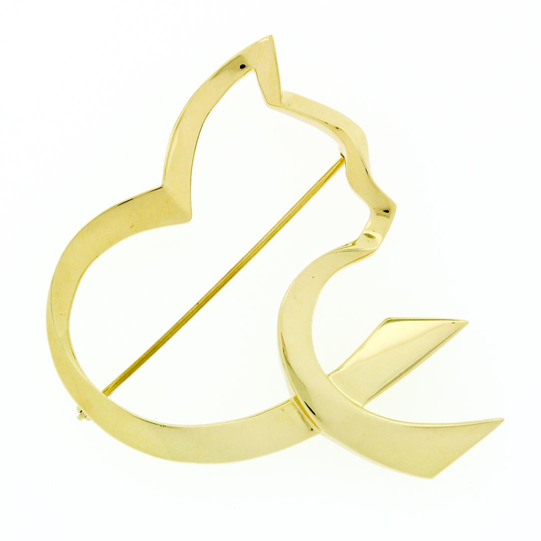 Tiffany & Co. Paloma Picasso Graffiti 18k Yellow Gold: An authentic, vintage, Tiffany & Co. solid 18k yellow gold graffiti open cat ribbon brooch. Measures 44.40x50.74mm and weighs a total of 17.26 grams.