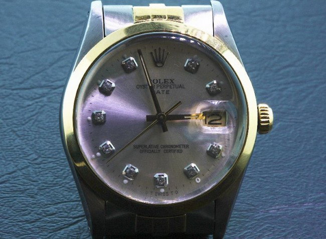 Men's Two-Tone Rolex Date Model Watch A477 FULL APPRAIS: Men's Two-Tone Rolex Date Model Watch A477 FULL APPRAISAL - Awesome Watch, Great Condition. Weighs 88.52 grams. 18KT Yellow Gold, Diamond Markers. Comes will FULL LETTER from AIG. See Scan. Valued at 