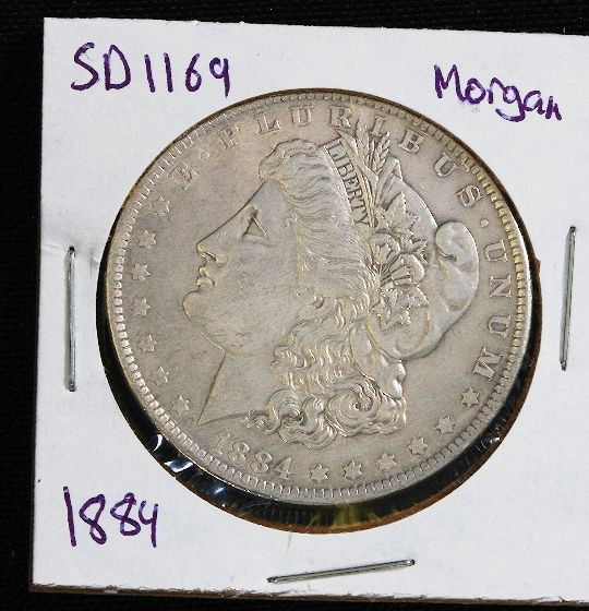 1884 Morgan Silver Dollar SD1169: 1884 Morgan Silver Dollar SD1169 - Good Circulated Condition. AS712C - Thank you for viewing this lot. Be sure to check out all of our future auctions. We appreciate your business. Thanks again from S