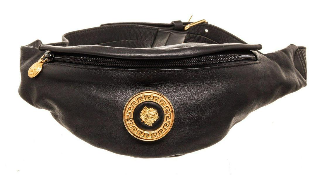 Versace Black Leather Waist Pouch Bag: Versace Black Leather Waist Pouch Bag with leather, gold-tone hardware, metal Medusa embellishments at exterior, protective feet at base, tonal leather lining, removable flat shoulder strap, single in