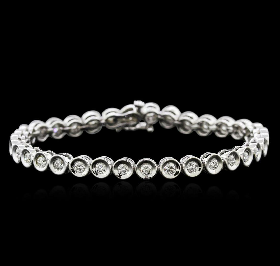 14KT White Gold 2.32 ctw Diamond Tennis Bracelet: One electronically tested 14KT white gold ladies cast diamond tennis bracelet with a hidden box clasp with safety closer with a bright polish finish. Measurements: 7" in length Identified with marking
