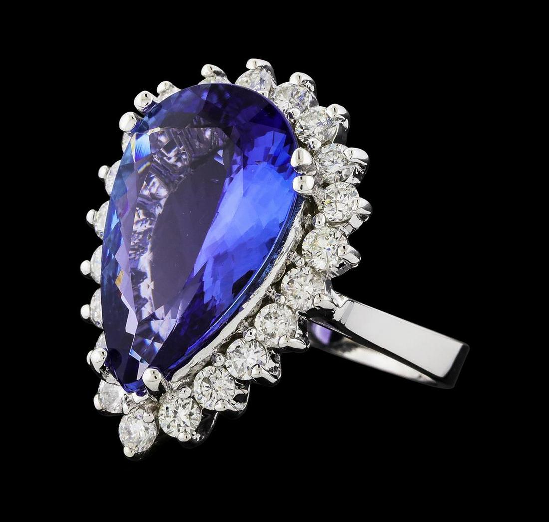 GIA Cert 8.74 ctw Tanzanite and Diamond Ring - 14KT: One electronically tested 14KT white gold lady's cast fashion ring with a basket halo with a bright polish finish. The featured lady's ring has a shank measuring 2.98 millimeters wide. Identified with