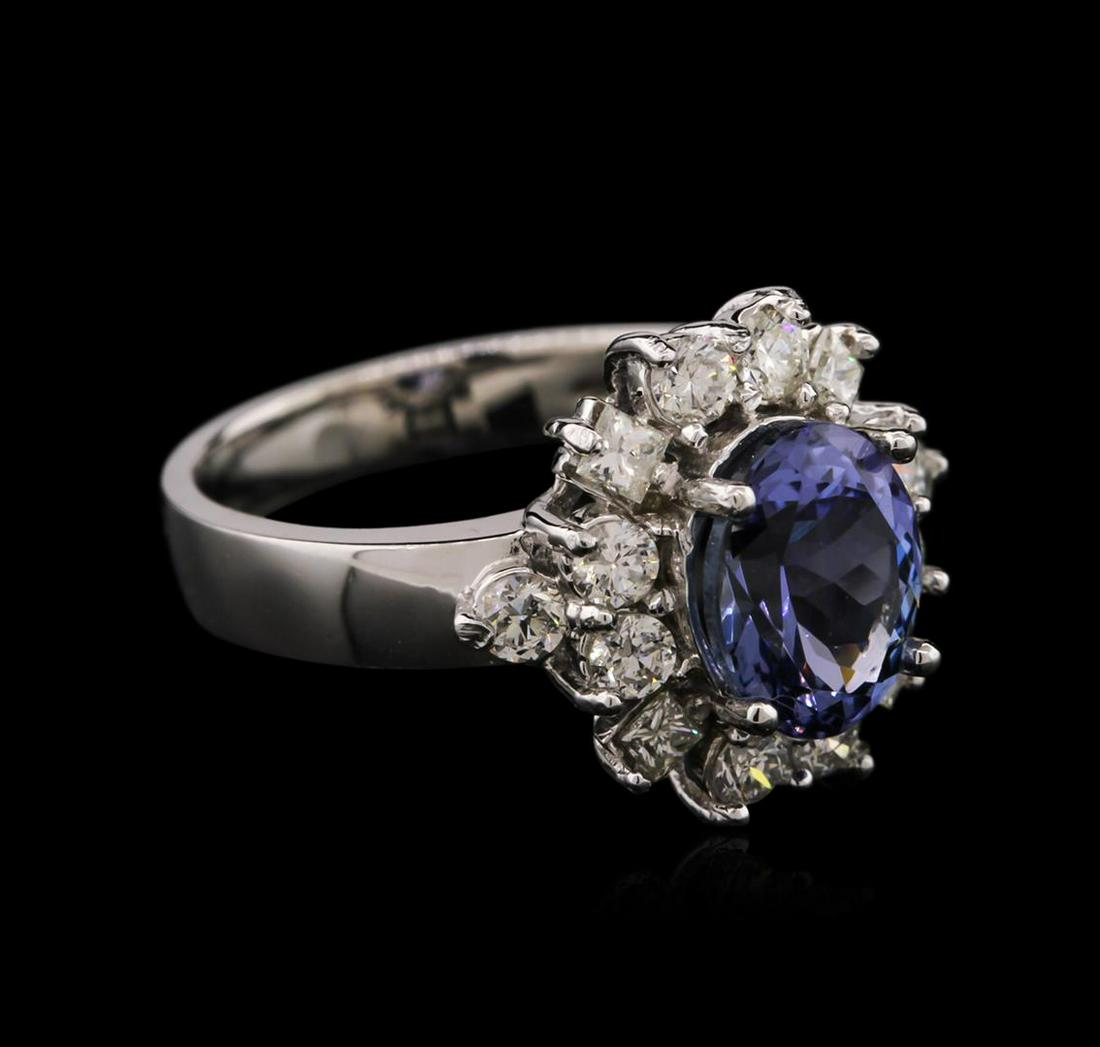 14KT White Gold 2.24 ctw Tanzanite and Diamond Ring: One electronically tested 14KT white gold ladies cast tanzanite and diamond ring with a bright polish finish. Identified with markings of "14K". Condition is new. Containing: One prong set oval modifi