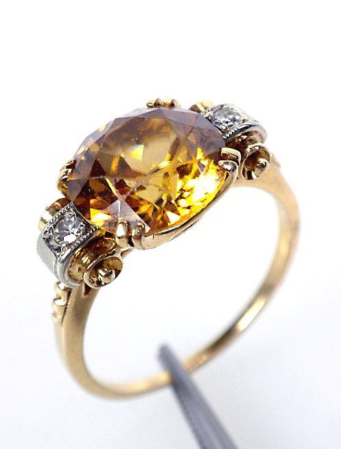 14KT Yellow Gold Zircon & Diamond Ring A1704: "14KT Yellow Gold Zircon & Diamond Ring A1704. Excellent Condition! One electronically tested 14KT yellow gold ladies cast zircon and diamond ring. The featured zircon is accented with diamonds. Brigh