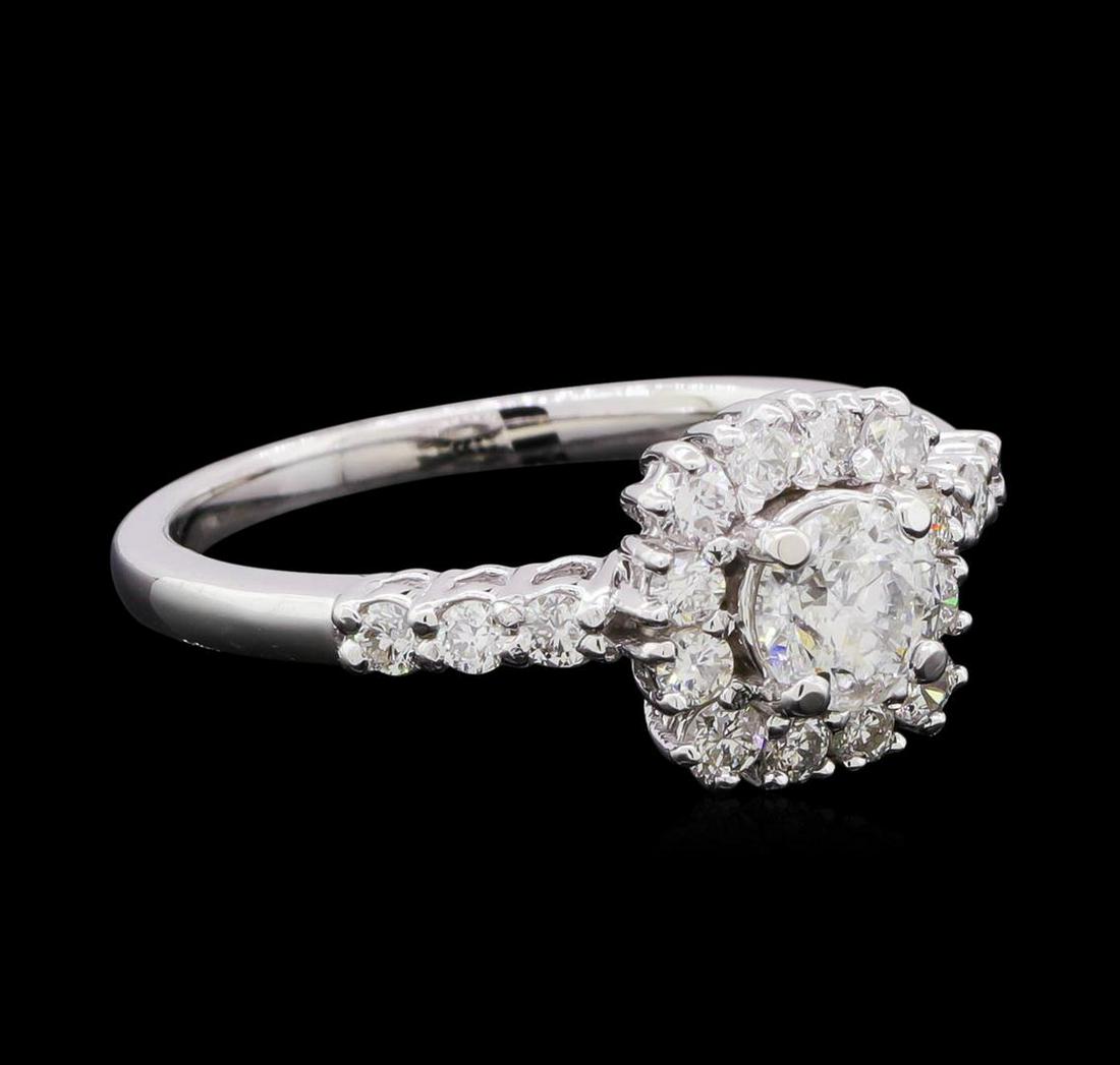 0.98 ctw Diamond Ring - 14KT White Gold: One electronically tested 14KT white gold lady's cast wedding ring with a basket halo with a bright polish finish. The featured lady's ring has a shank measuring 1.75 millimeters in width. Identified