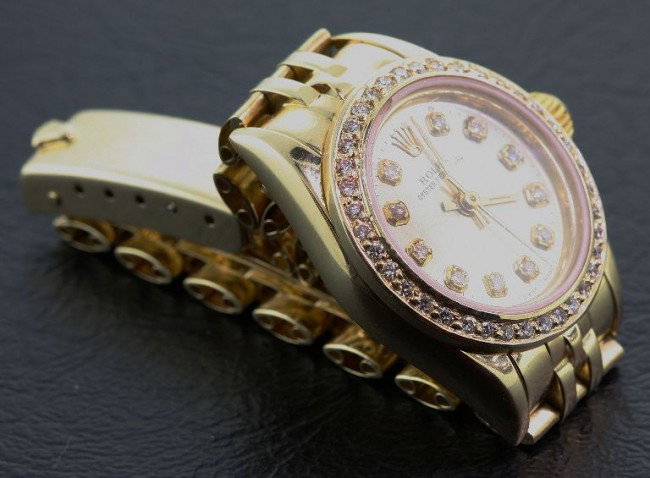 Ladies 18KTY Rolex Oyster Perpetual Wristwatch A37: "Ladies 18KTY Rolex Oyster Perpetual Wristwatch A374 . Excellent Condition! One ladies, handcrafted & machine milled Rolex perpetual model wristwatch electronically tested 14KT yellow gold. Circa 1986