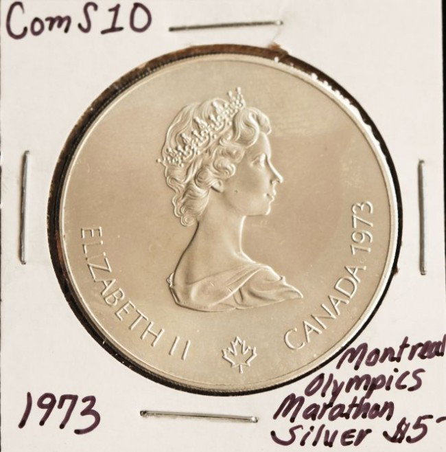 1973 Montreal Olympics Marathon $5 Silver Coin COM: "1973 Montreal Olympics Marathon $5 Silver Coin COMS10. As-Is Condition! BY61PM. 1973 Montreal Olympics Marathon $5 Silver Coin. 24.1 grams of Silver. Thank you for viewing this lot. We are always add