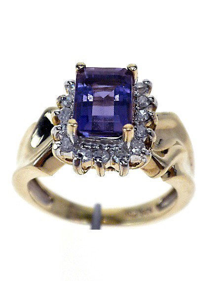 10KT Yellow Gold Ladies Iolite & Diamond Ring. A1377: "10KT Yellow Gold Ladies Iolite & Diamond Ring. A1377. Excellent Condition! One electronically tested 10KT yellow gold ladies cast iolite and diamond ring. The featured iolite is set within a diamond