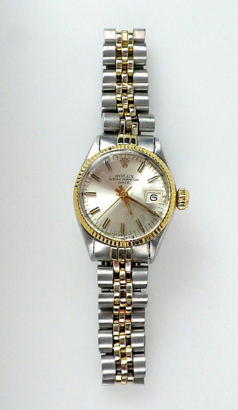 Lady Rolex Two-Tone Date Model Wrist Watch. 45.12 gm. A: "Lady Rolex Two-Tone Date Model Wrist Watch. 45.12 gm. A869 Excellent Condition! PL1061MK One ladies, hand crafted & machine milled Rolex Date Model Stainless Steel & 14KT yellow gold wristwatch elect