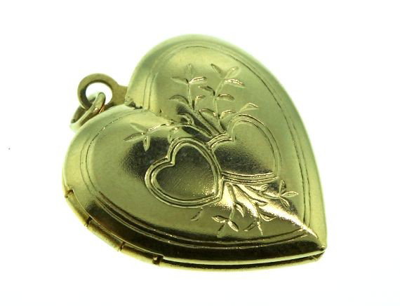 14K Gold Locket 3 gm GD38: "14K Gold Locket 3 gm GD38. As-Is Condition! VC19UI. One 14K gold locket measuring approx. 1/2" wide x 1" tall. Engraved with two hearts and surrounding foliage this locket weighs 3 gm. Thank you for 