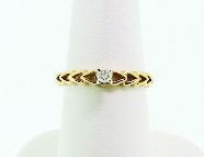 10KT Gold Diamond Solitaire Ring 2.10 grams A528: "10KT Gold Diamond Solitaire Ring 2.10 grams A528 Excellent Condition! 10KT yellow gold ladies cast diamond solitaire ring. Diamond 0.13ct. AIG Appraised at $511. - Thank you for viewing this lot. We 