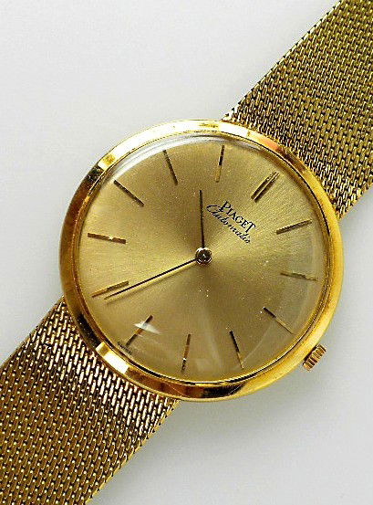Piaget Wristwatch 60.24gm. A1565: "Piaget Wristwatch 60.24gm. A1565. Excellent Condition! DQ1051GT One gents, hand crafted & machine milled Piaget wristwatch electronically tested 18KT yellow gold. Movement: Thirty jewel Piaget automa