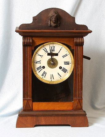 Antique Mantle Clock PH & S. Corral7: "Antique Mantle Clock PH & S. Corral7. Excellent Vintage Condition! NV101QA. Antique "Alarm" Mantle Clock by PH & S. This beatiful clock has an Art-Noveau lady's face carved at the top! 15-3/4 tall, 9