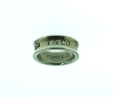 Genuine Tiffany & Co Ring GD62: "Genuine Tiffany & Co Ring GD62. As-Is Condition!. KJ14TF. One genuine silver Tiffany & Co. ring. Identified with markings of "1997 Tiffany & Co. 925" on the inside and "925 T & CO 1837" around the ou
