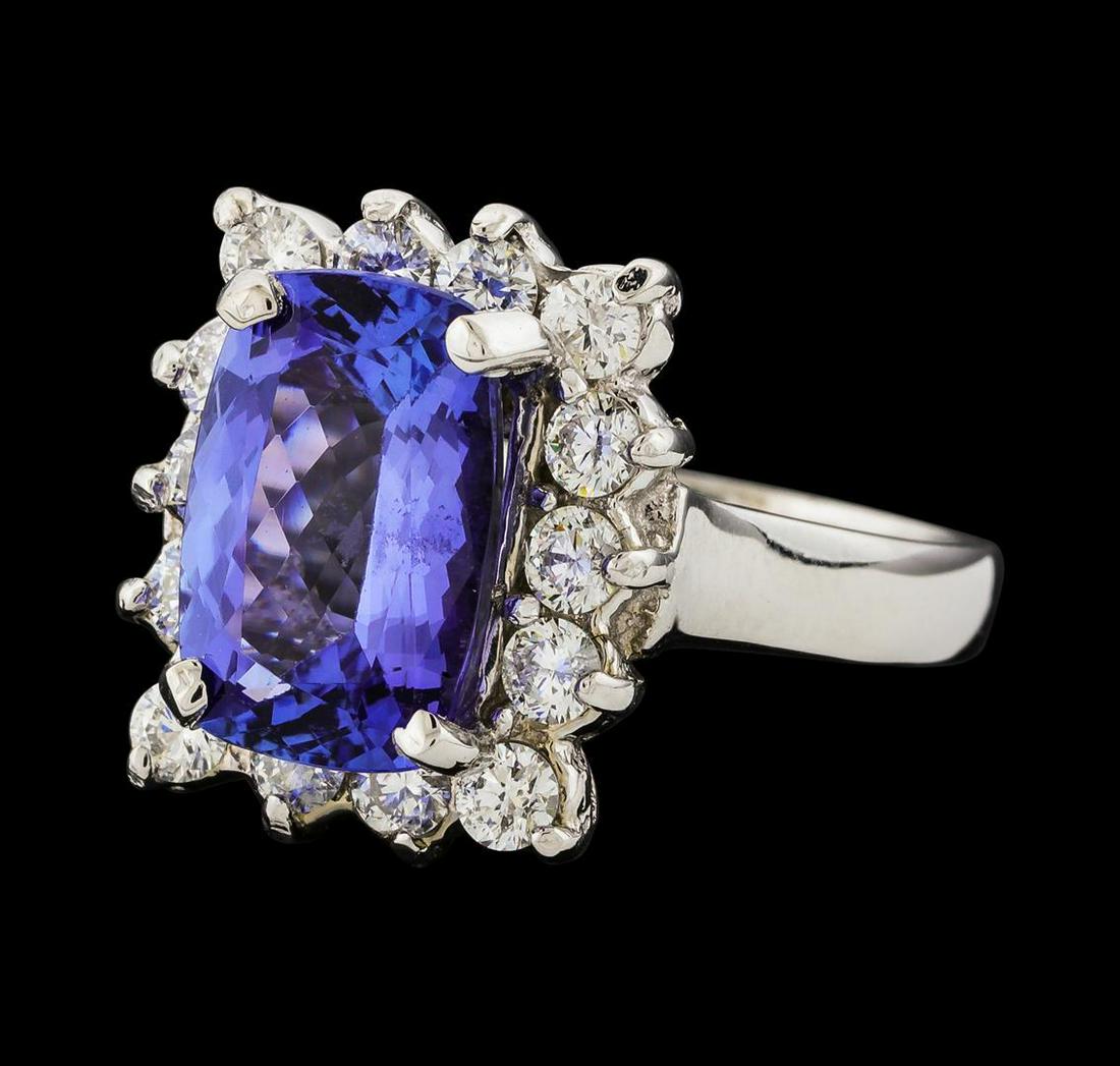 3.84 ctw Tanzanite and Diamond Ring - 14KT White Gold: One electronically tested 14KT white gold lady's cast fashion ring with a cathedral shank with a basket halo with a bright polish finish. The featured lady's ring has a shank measuring 2.71 millimeter