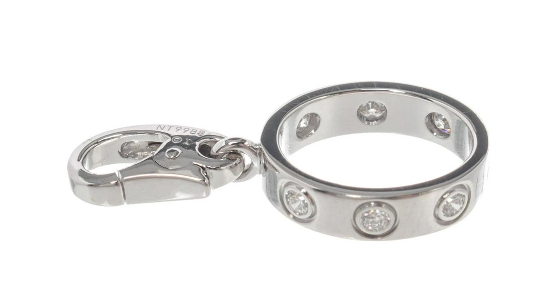 Cartier Silver Baby Love Charm: Cartier Silver Baby Love Charm with silver-tone hardware.