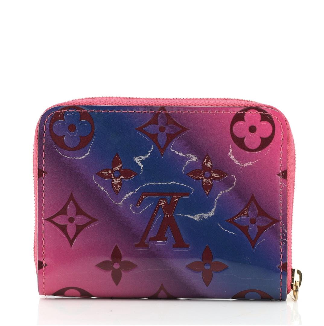 Louis Vuitton Pink Gradient Monogram Vernis Zippy Coin Purse: Pink Gradient Monogram Vernis leather of Louis Vuitton Zippy coin purse with gold-tone hardware, tonal leather lining, dual interior compartments, six card slots and zip-around closure.