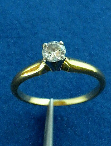 18KT Yellow Gold Diamond Solitaire Ring A2490: "18KT Yellow Gold Diamond Solitaire Ring A2490. Good Condition! IU311MV. One electronically tested 18KT yellow gold ladies cast diamond solitaire ring. Condition is good. Bright polish finish with rho