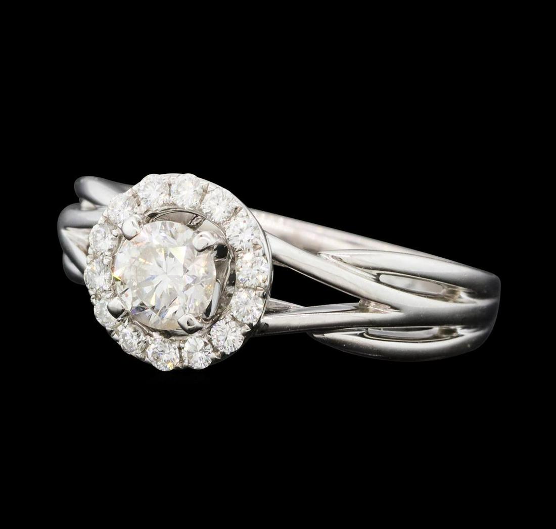 0.74 ctw Diamond Ring - 14KT White Gold: One electronically tested 14KT white gold lady's cast wedding ring with a split shank basket halo with a bright polish finish. The featured lady's ring has a shank measuring 2.38 millimeters wide. Ide