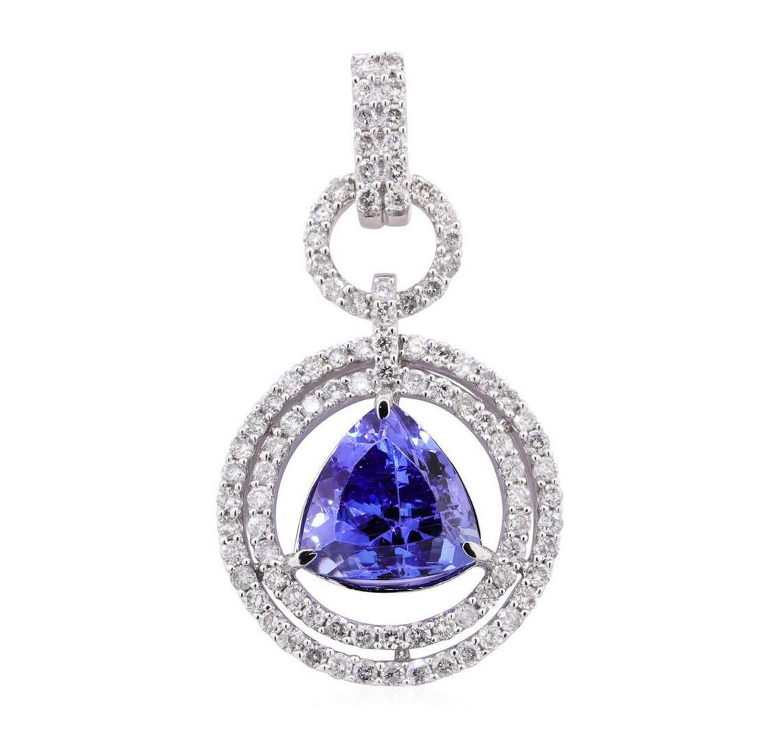 6.85 ctw Tanzanite and Diamond Pendant - 14KT White Gold: One electronically tested 14KT white gold lady's combination cast & assembled fashion pendant with a double halo with a bright polish finish. The featured lady's pendant has a double circular drop mot