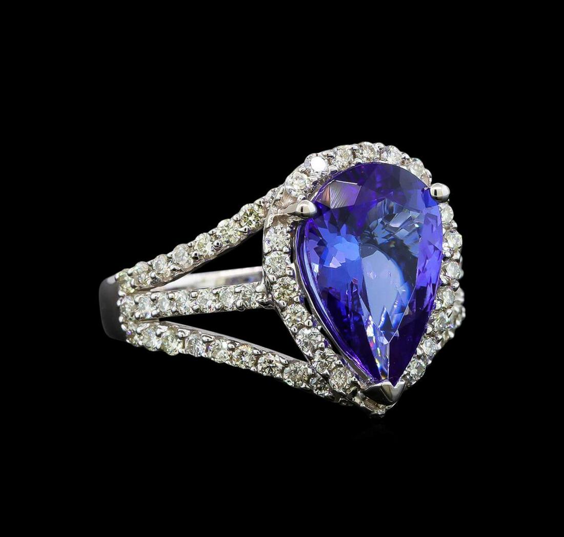 18KT White Gold 3.62 ctw Tanzanite and Diamond Ring: One electronically tested 18KT white gold ladies cast tanzanite and diamond ring with a tapered shank with a bright polish finish. Trademark is Orianne. Identified with markings of "18K". Condition is