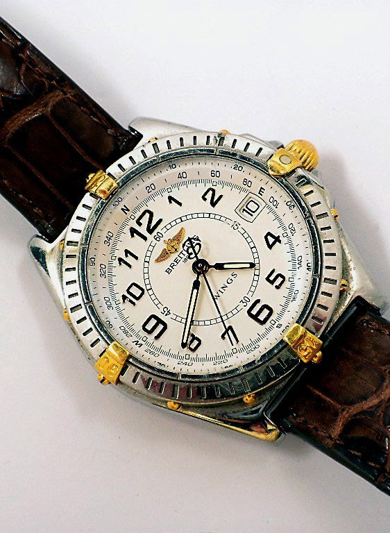 Breitling Windrider Wings Wristwatch NS115: "Breitling Windrider Wings Wristwatch NS115. Good Condition! KB104HX. One gentlemans custom Breitling Windrider Wings wristwatch. This 18KT yellow gold and stainless steel, undirectional bezel wristwa