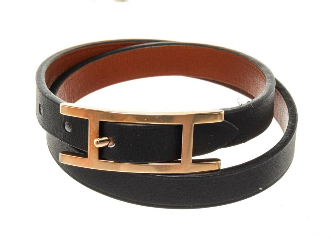 Hermes Black Leather Behapi Bracelet: Hermes Black Leather Behapi Bracelet with leather gold-tone hardware and turn lock closure.