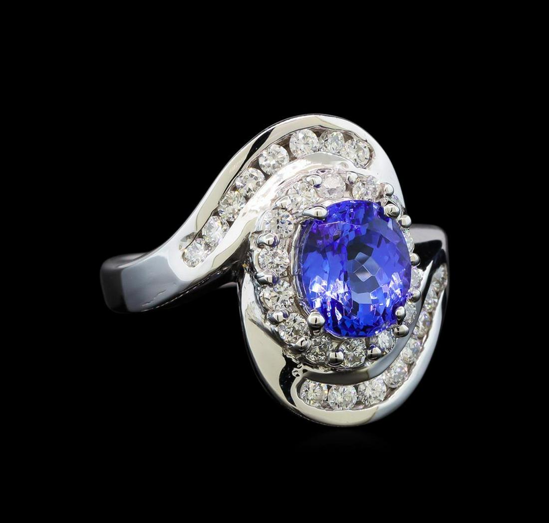 14KT White Gold 1.91 ctw Tanzanite and Diamond Ring: One electronically tested 14KT white gold ladies cast tanzanite and diamond ring with a bright polish finish. Identified with markings of "14K". Condition is new. Containing: One prong set oval modifi