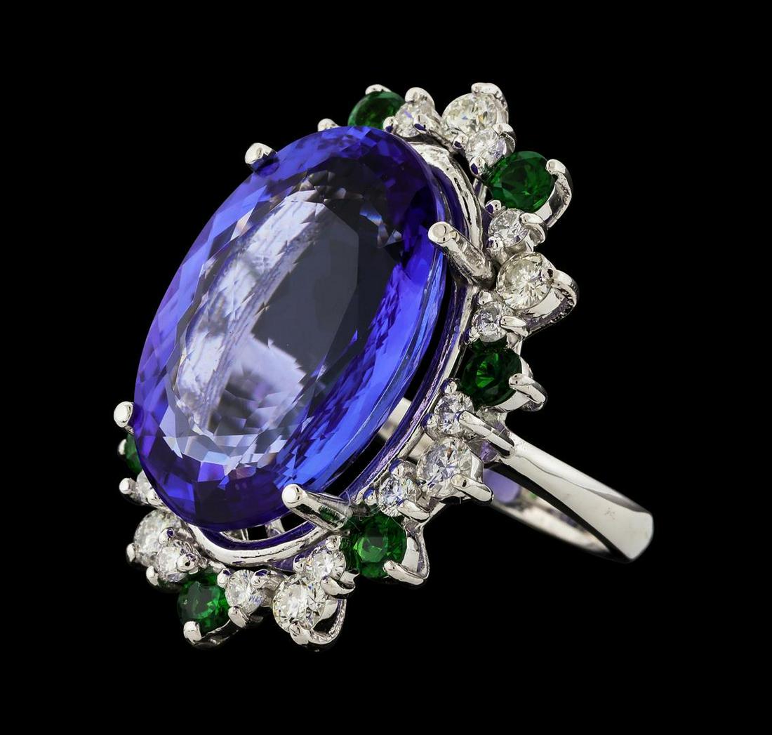 20.78 ctw Tanzanite and Diamond Ring - 14KT White Gold: One electronically tested 14KT white gold lady's cast fashion ring with a staggered basket halo with a bright polish finish. The featured lady's ring has a shank measuring 2.59 millimeters wide. Ident