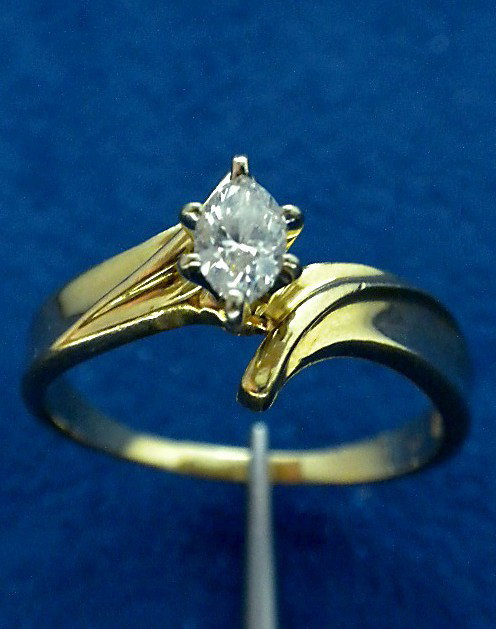 14KT Yellow Gold Diamond Solitaire Ring A2487: "14KT Yellow Gold Diamond Solitaire Ring A2487. Good Condition! UM731LI. One electronically tested 14KT yellow gold ladies cast diamond solitaire ring with a bright finish. Condition is good. Identifi