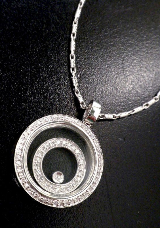 14KT White Gold Diamond Pendant w/Chain 0.25ct A2644: 14KT White Gold Diamond Pendant w/Chain 0.25ct A2644. Good Condition! GX144HW. One electronically tested 14KT white gold ladies cast & assembled diamond pendant with chain. The Chopard inspired pendan