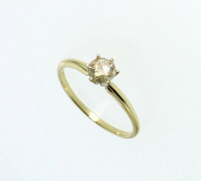 14KT Yellow Gold Diamond Solitaire Ring A2680: "14KT Yellow Gold Diamond Solitaire Ring A2680. Good Condition! NH78UC. One electronically tested 14KT yellow gold ladies cast diamond solitaire ring with a bright polish finish. Identified with marki