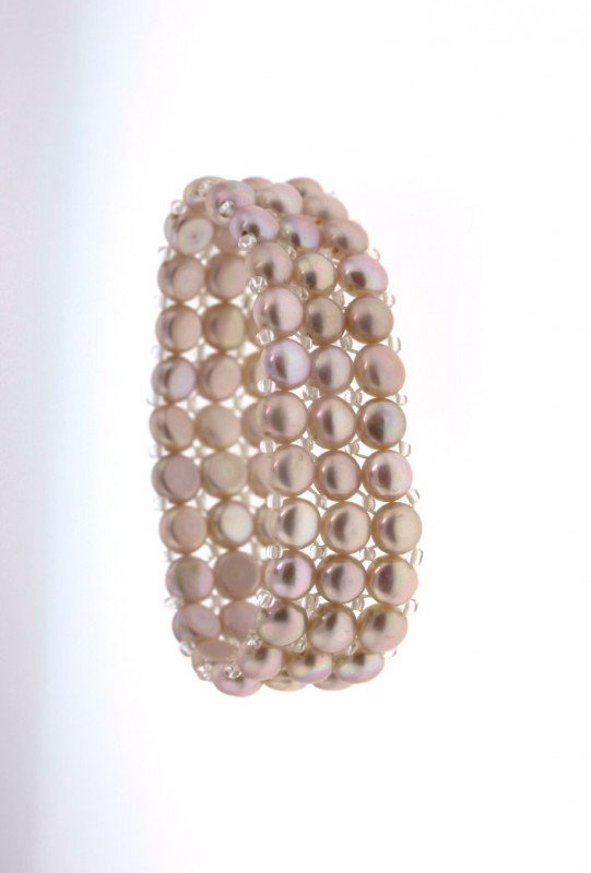 6.5" Cultured Champagne Pink Pearl Bracelet PS37: "6.5" Cultured Champagne Pink Pearl Bracelet PS37. Excellent Condition! BC3EW. One approx. 6.5" champagne colored cultured pearl bracelet. Stretches for adjusting to different sizes of wrists, with 3 