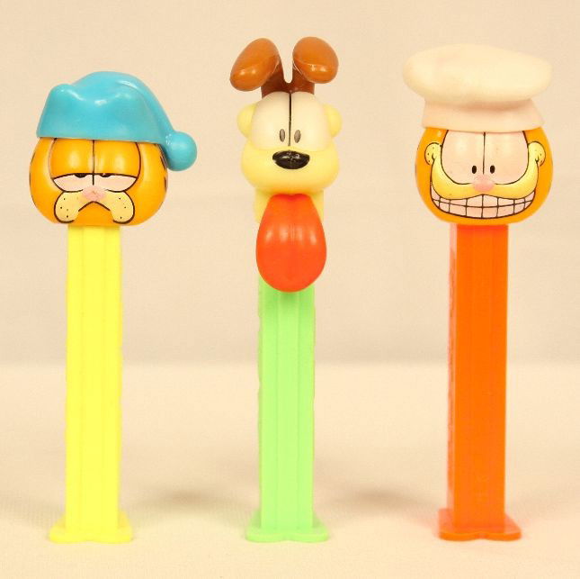 Lot of 3 Garfield & Friends PEZ Dispensers ED939: "Lot of 3 Garfield & Friends PEZ Dispensers ED939. Excellent Vintage Condition! JS3XU. Lot of 3 Garfield & Friends PEZ dispensers. Included are "Chef Garfield", "Sleepy Garfield", and "Odie", introduc