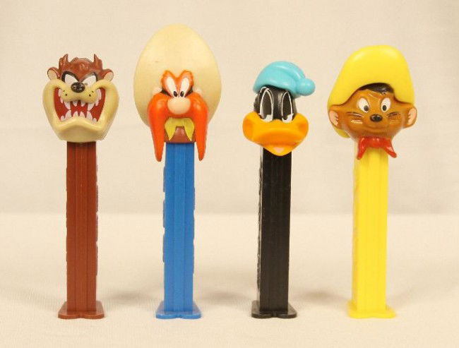 Lot of 4 Looney Tunes PEZ Dispensers ED949: "Lot of 4 Looney Tunes PEZ Dispensers ED949. As-Is Condition! IE4GC. Lot of 4 Looney Tunes PEZ dispensers. Included is one 4.9 "Yosemite Sam", 4.9 "Tazmanian Devil", 4.9 "Speedy Gonzalez" introduced i