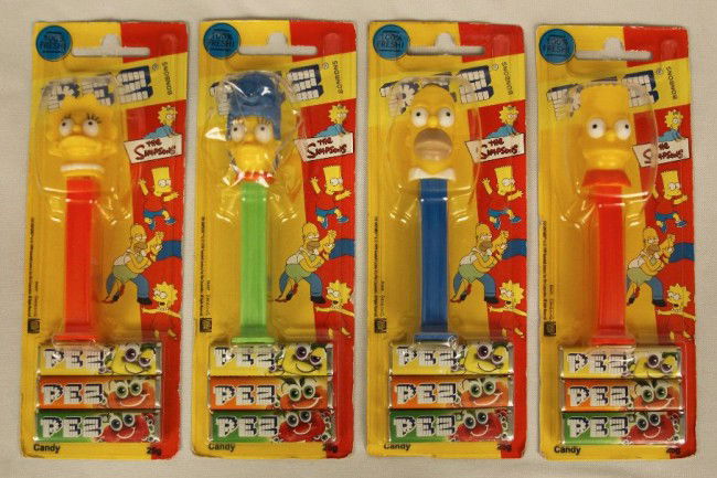 Lot of 4 Simpsons PEZ Dispensers & Candy ED947: "Lot of 4 Simpsons PEZ Dispensers & Candy ED947. As-Is Condition! QJ4XS. Lot of 4 Simpson's PEZ dispensers & candy. Included are 4.9 "Marge", 4.9 "Homer", 5.9 "Bart", and 5.9 "Lisa" introduced in 2000