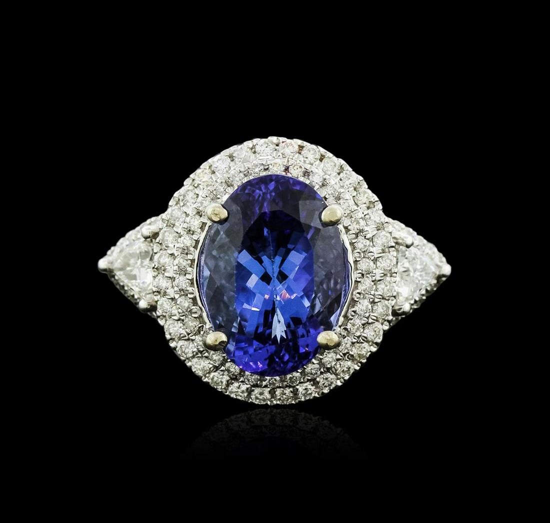 14KT White Gold 3.50 ctw Tanzanite and Diamond Ring: One electronically tested 14KT white gold ladies cast tanzanite and diamond ring with a bright and brushed finish. Identified with markings of "14K". Condition is new. Containing: One prong set oval m
