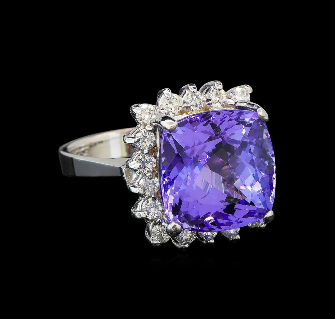 14KT White Gold 8.63 ctw Tanzanite and Diamond Ring: One electronically tested 14KT white gold ladies cast tanzanite and diamond ring with a bright polish finish. Identified with markings of "K14". Condition is new. Containing: One prong set square cush