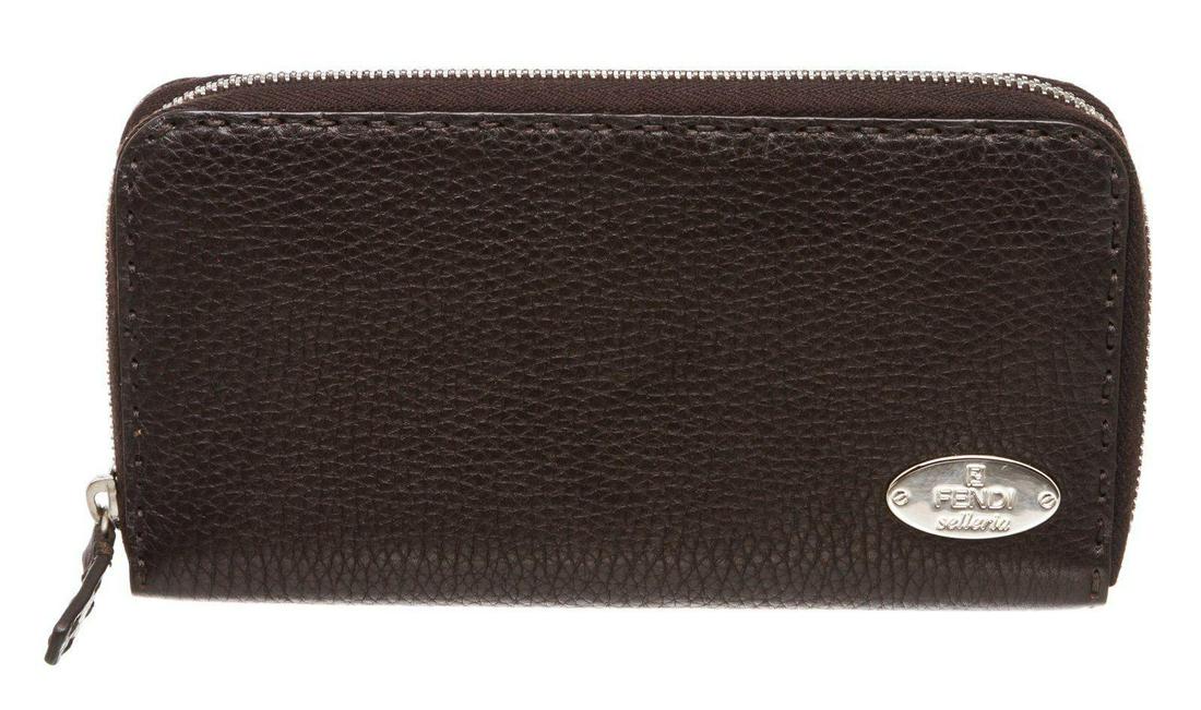 Fendi Dark Brown Salleria Leather Zip Around Wallet: Fendi Salleria dark brown leather zip around wallet with silver-tone hardware, center zip pocket, dual bill pockets, and eight card slots. Measurements: Length: 7.5 in / 19 cm Width: 1 in / 3 cm 4 in