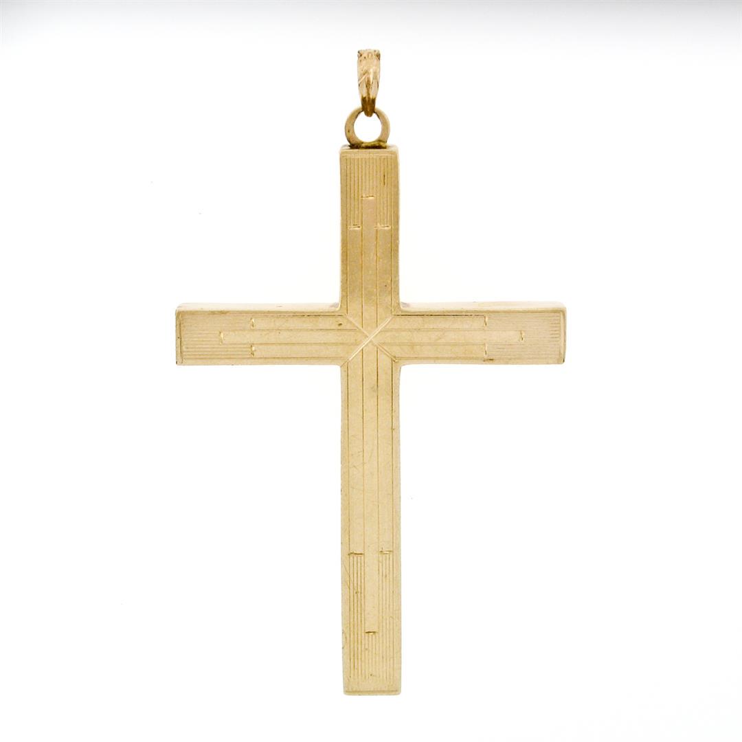 Large Antique Esemco 10K Rosy Yellow Gold Puffed Engraved Polished Cross Pendant: A solid 10k rosy yellow gold cross pendant by Esemco. The pendant weighs a total of 2.21 grams, measures 50.70x29.25mm including the bail, and the inside of the bail measures 4.25x2.25mm.