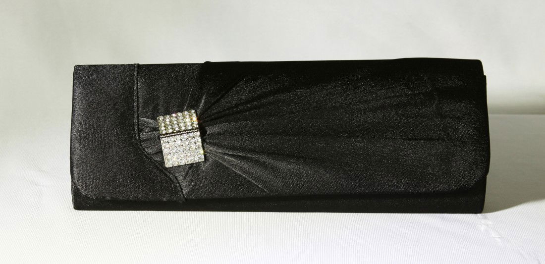 Black Rhinestone Evening Purse RTB65: "Black Rhinestone Evening Purse RTB65. Great Condition! EQ6LZ. One black and rhinestone purse measuring 4" tall X 10.5" long X 2" width. Decorated with clasped rhinestones this purse comes with attach