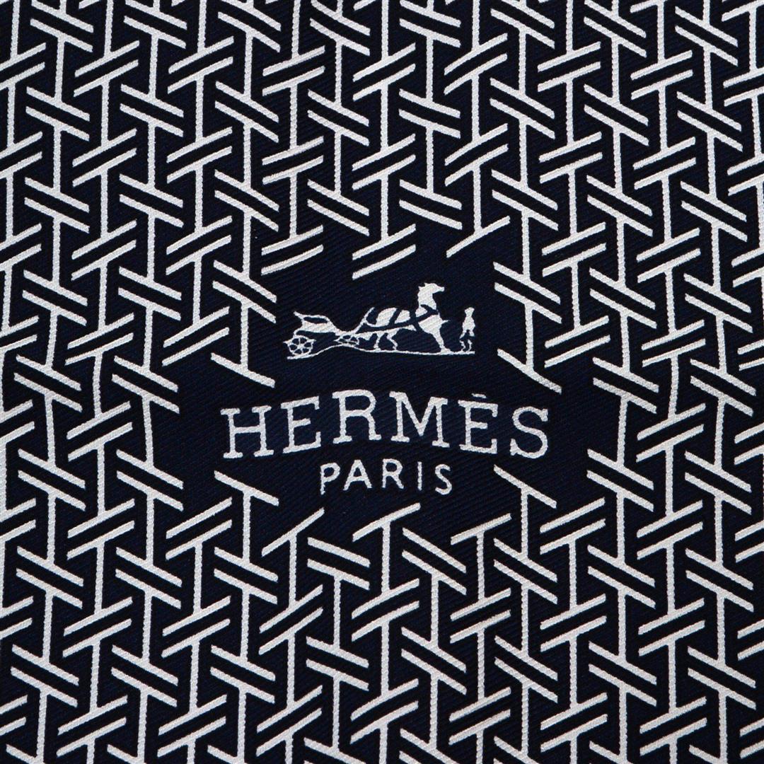 Hermes Black La Cravate-Foulard Silk Scarf: Hermes Black La Cravate-Foulard Silk Scarf with silver-tone hardware, hand-rolled edges. Condition: Pre-Owned GoodGood overall, please see photographs for detail.